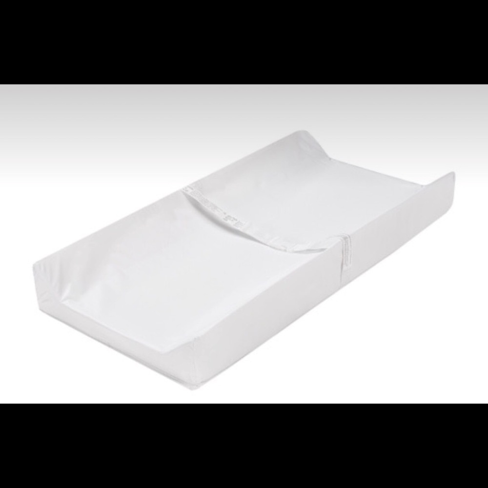 Crib mattress and changing table pad